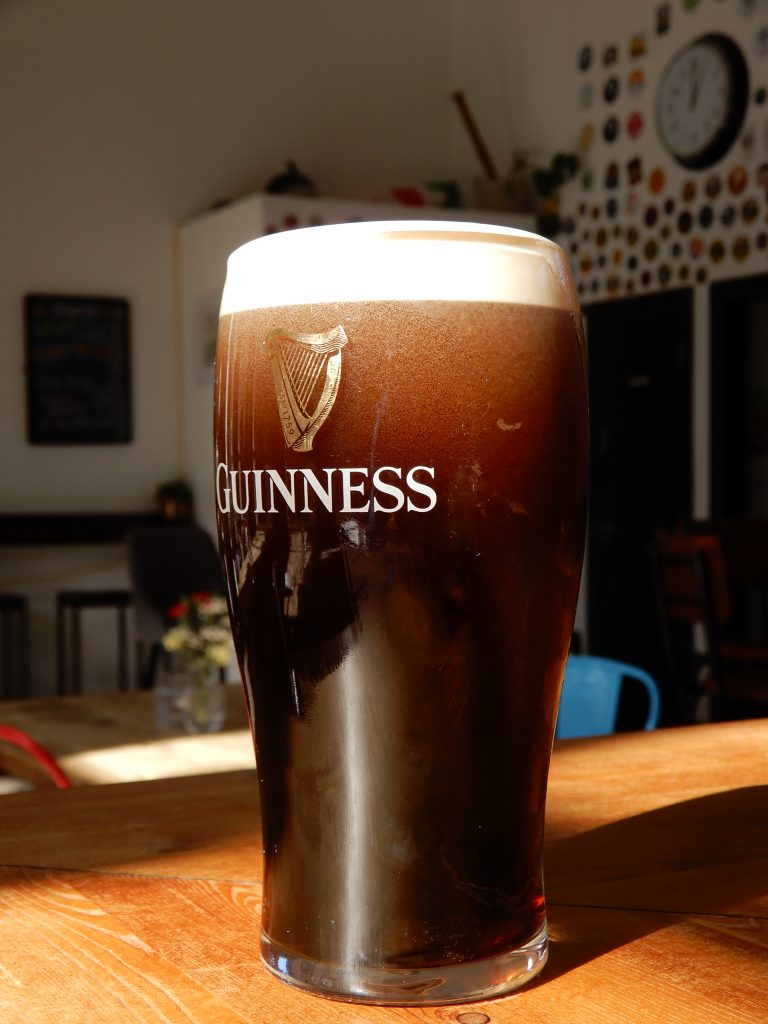 A fresh pint of stout on the Perfect Hive bar.