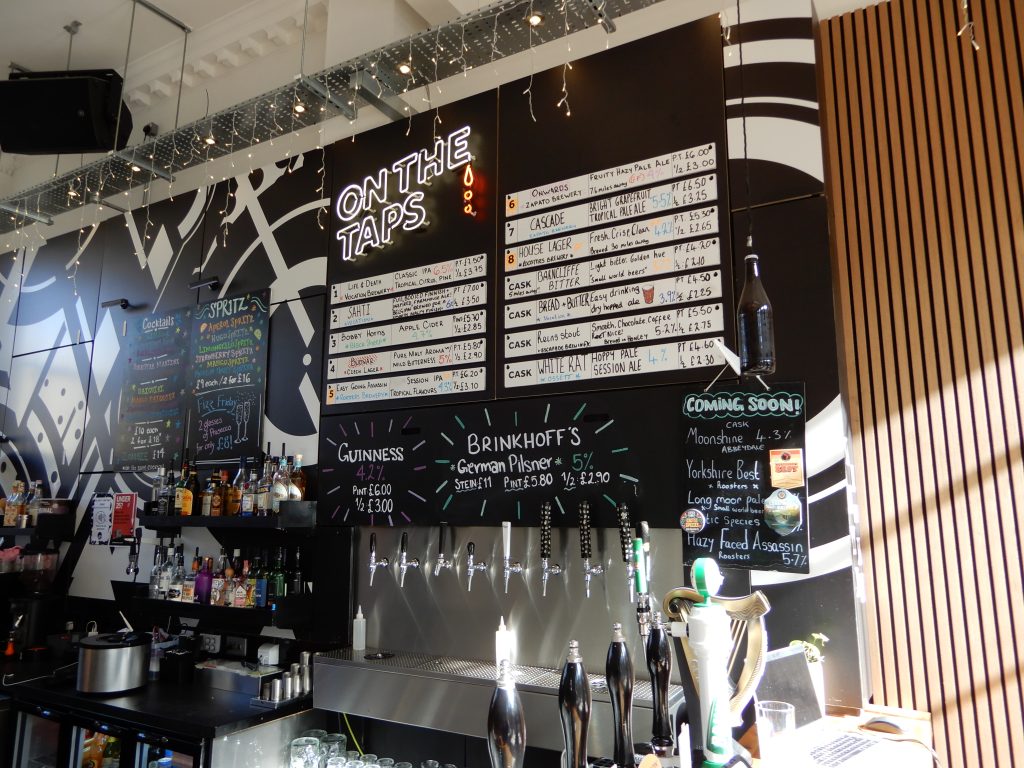 The Perfect Hive tap wall and beer menus.