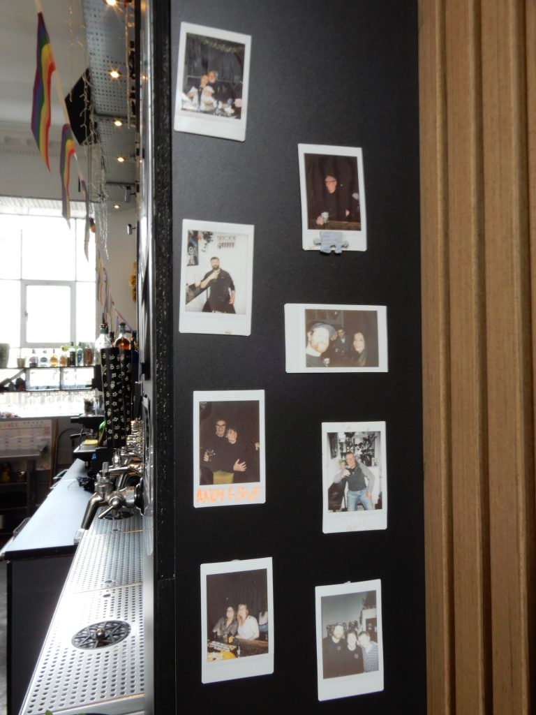 Framed photographs inside Perfect Hive.