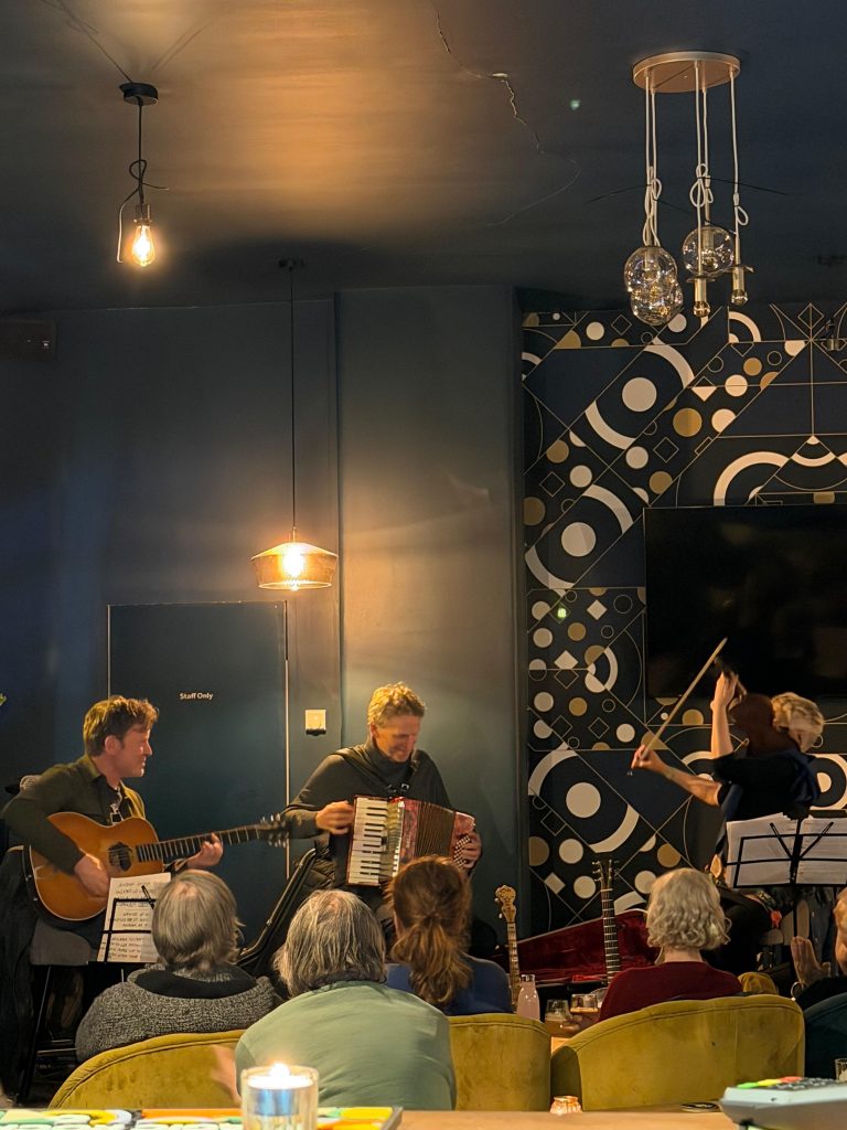 Musicians playing live at Perfect Hive.